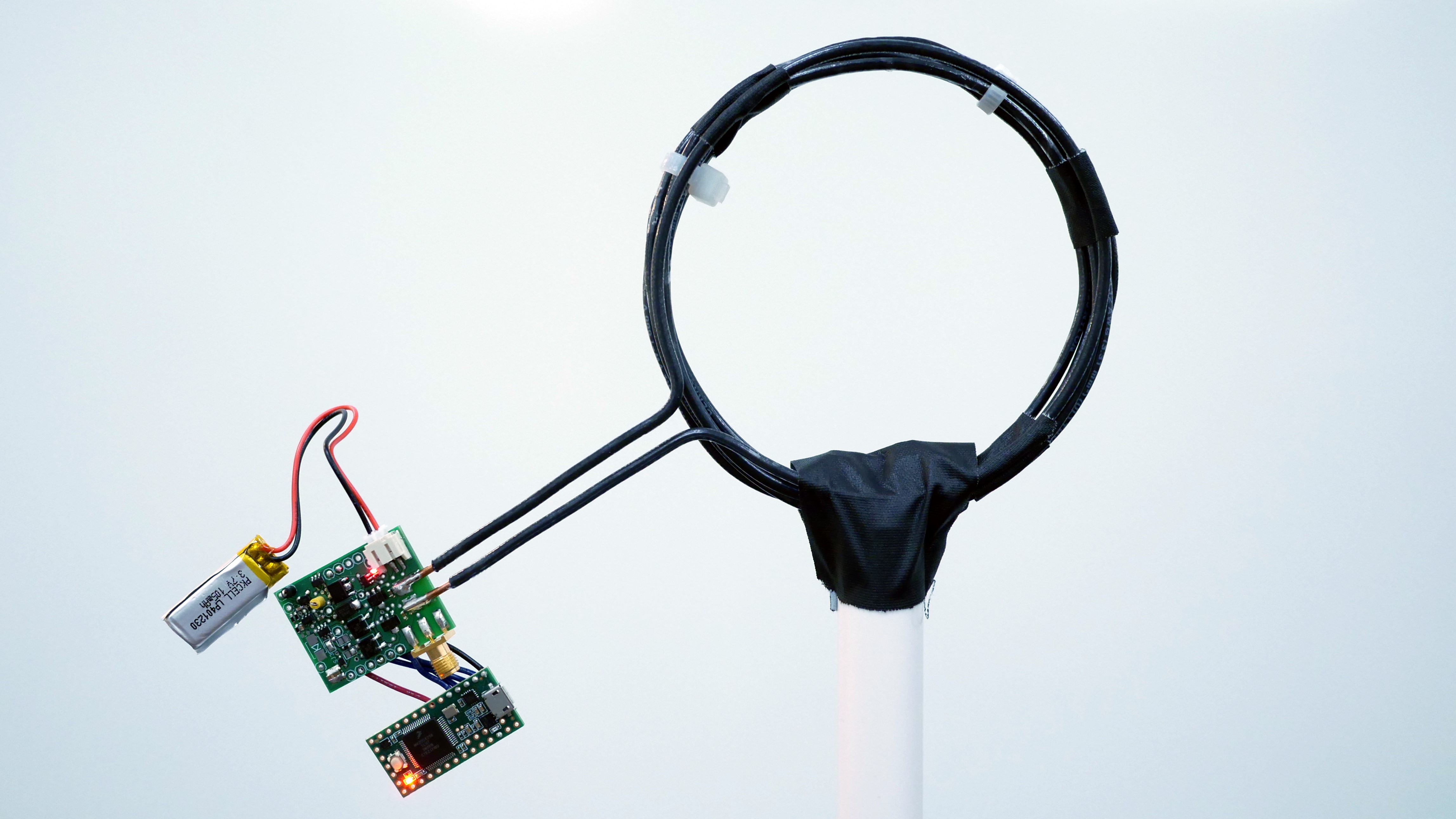 Room-Wide Wireless Charging and Load-Modulation Communication via Quasistatic Cavity Resonance